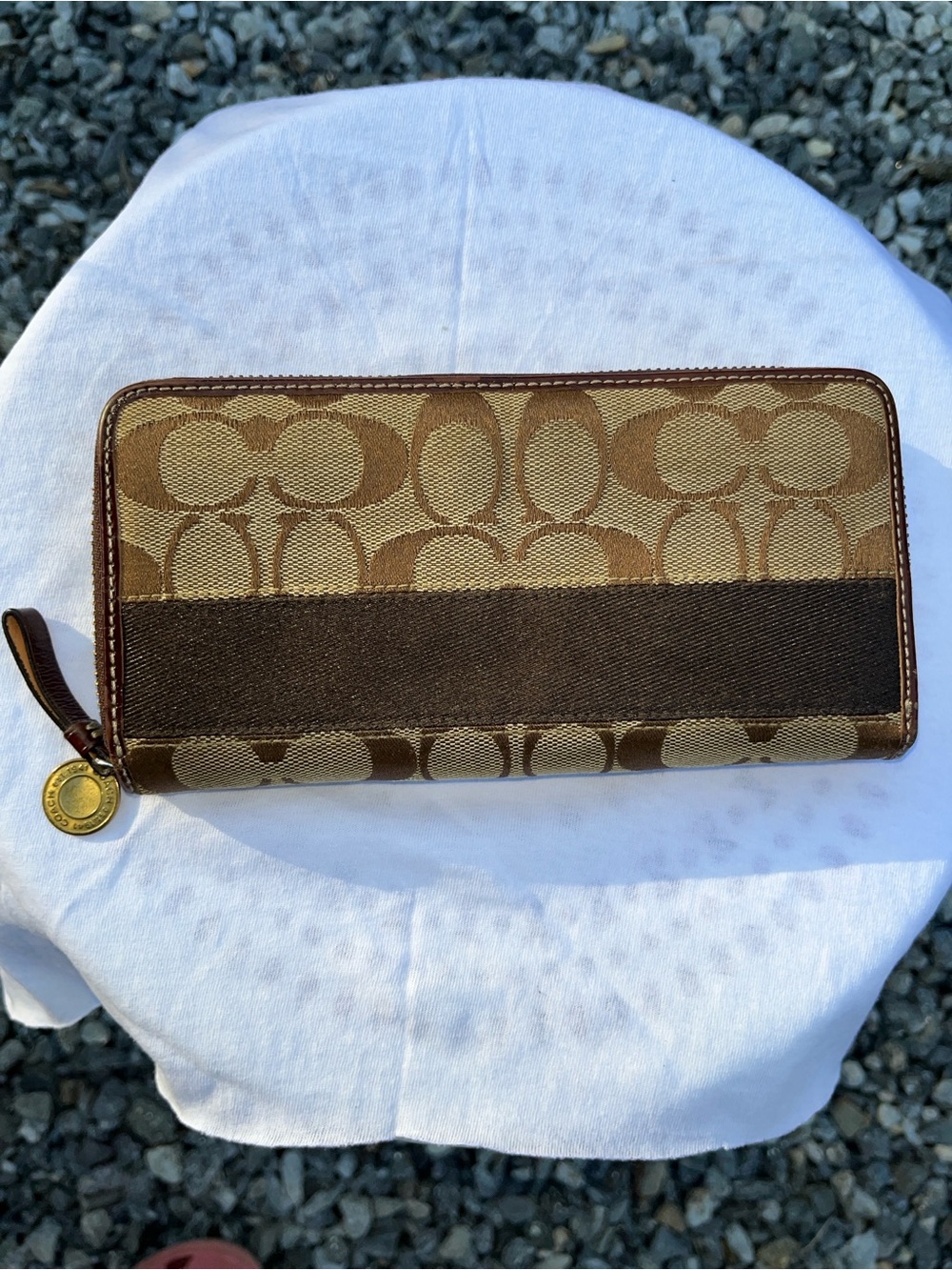 Coach Signature canvas zip-around accordion wallet featuring a signature